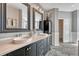 Elegant bathroom with double vanity, granite countertop, modern fixtures, and plenty of storage at 570 Stonemont Dr, Castle Pines, CO 80108