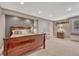Bedroom featuring carpeted floor, furniture, and natural light at 570 Stonemont Dr, Castle Pines, CO 80108