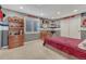 Sports themed bedroom with custom paint and design elements including built-in shelving and a closet at 570 Stonemont Dr, Castle Pines, CO 80108