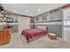 Sports themed bedroom with custom paint and design elements including built-in shelving and a closet at 570 Stonemont Dr, Castle Pines, CO 80108