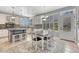 Breakfast nook featuring a table set, bright windows, and nearby island counter at 570 Stonemont Dr, Castle Pines, CO 80108