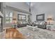 Bright living room boasts high ceilings, hardwood floors, and stylish decor at 570 Stonemont Dr, Castle Pines, CO 80108