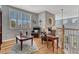Stylish living area features hardwood floors, comfortable seating, and natural light from shuttered windows at 570 Stonemont Dr, Castle Pines, CO 80108