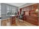 Spacious home office features custom built-ins, hardwood floors, plantation shutters, and plenty of room at 570 Stonemont Dr, Castle Pines, CO 80108