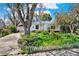 Charming single-story home with a beautiful front yard and a detached garage at 5211 Dover St, Arvada, CO 80002