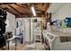 A functional laundry room with washer, dryer, wash basin, and folding screen offers practicality and convenience at 5211 Dover St, Arvada, CO 80002