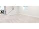 Spacious, unfinished basement with a staircase, a window and neutral carpeting at 8582 Cheraw St, Littleton, CO 80125