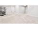 Spacious basement area with neutral carpet and staircase at 8582 Cheraw St, Littleton, CO 80125