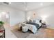 Inviting bedroom featuring a king bed, soft carpeting, and calming decor for a restful atmosphere at 8582 Cheraw St, Littleton, CO 80125