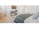Comfortable bedroom with neutral carpet, stylish furniture, and modern decor at 8582 Cheraw St, Littleton, CO 80125