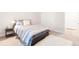 Bright bedroom features a bed with stylish striped bedding and a fur rug at 8582 Cheraw St, Littleton, CO 80125