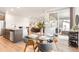 Bright dining area with a glass table, seating for four, and sliding doors leading to an outdoor space at 8582 Cheraw St, Littleton, CO 80125