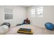 Spacious exercise room with workout equipment and multiple windows at 8582 Cheraw St, Littleton, CO 80125