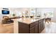 Bright kitchen with granite countertops, a modern sink, and plenty of natural light overlooking the living area at 8582 Cheraw St, Littleton, CO 80125