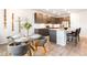 Stylish kitchen with stainless steel appliances, granite countertops, and a dining area with seating for four at 8582 Cheraw St, Littleton, CO 80125