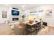Comfortable living room with a modern fireplace, a TV, and a cozy sofa and a view to the backyard at 8582 Cheraw St, Littleton, CO 80125