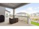 Covered patio area showcasing a table and chairs, providing an outdoor space for relaxation at 8582 Cheraw St, Littleton, CO 80125