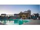 Community pool and clubhouse on a clear evening at 8582 Cheraw St, Littleton, CO 80125