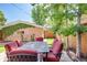 This outdoor space includes a stone surface, beautiful landscaping, and a dining set perfect for outdoor entertaining at 1622 Monroe St, Denver, CO 80206