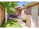 This lovely outdoor space includes a patio with a dining set, a brick home, and a manicured lawn at 1622 Monroe St, Denver, CO 80206