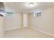 Finished basement space with neutral carpet, paint, and a closet at 1622 Monroe St, Denver, CO 80206
