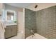 Modern bathroom with stylish vanity, tile shower, and updated fixtures at 1622 Monroe St, Denver, CO 80206