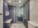 Elegant bathroom with a glass-enclosed shower, subway tile, marble accents, and modern fixtures at 1622 Monroe St, Denver, CO 80206