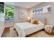 Comfortable bedroom with natural lighting and hardwood floors at 1622 Monroe St, Denver, CO 80206