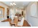 Open-concept dining area with view to kitchen and back door at 1622 Monroe St, Denver, CO 80206