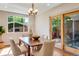Bright dining room with glass doors leading to patio space at 1622 Monroe St, Denver, CO 80206
