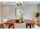 Dining room with a chandelier, seating for four, and view of backyard at 1622 Monroe St, Denver, CO 80206