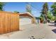 The exterior garage has a two-car garage door, a brick exterior, and a private alley entrance at 1622 Monroe St, Denver, CO 80206
