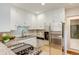 Modern kitchen with white cabinets, stainless steel appliances, and granite countertops at 1622 Monroe St, Denver, CO 80206