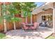 This outdoor patio has a stone surface, seating, and a table perfect for entertaining outdoors at 1622 Monroe St, Denver, CO 80206