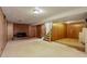 Basement featuring a fireplace, stairway, and utility space at 1720 S Balsam St, Lakewood, CO 80232