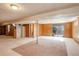 Large basement space features carpet flooring, drop ceiling and walk-out at 1720 S Balsam St, Lakewood, CO 80232