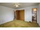 Bedroom features a closet and ensuite bath at 1720 S Balsam St, Lakewood, CO 80232