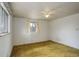 Bedroom features a window and ceiling fan at 1720 S Balsam St, Lakewood, CO 80232