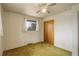 Bedroom featuring closet space, natural light, and ceiling fan at 1720 S Balsam St, Lakewood, CO 80232