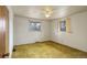 Spacious bedroom with two windows, a ceiling fan, and carpeted floors at 1720 S Balsam St, Lakewood, CO 80232