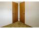 Closet featuring double doors and carpeted floors at 1720 S Balsam St, Lakewood, CO 80232