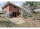 View of the building exterior with a patio at 1720 S Balsam St, Lakewood, CO 80232