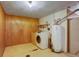 Basement laundry room with washer, dryer and water heater at 1720 S Balsam St, Lakewood, CO 80232