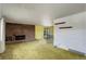 Inviting living room with a brick fireplace, large window, and cozy carpet at 1720 S Balsam St, Lakewood, CO 80232