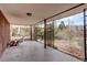 Covered patio area with vintage metal privacy screens, offering a tranquil outdoor space at 1720 S Balsam St, Lakewood, CO 80232