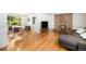 Open living room featuring hardwood floors, a fireplace, and ample natural light at 3900 Garland St, Wheat Ridge, CO 80033