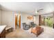 Inviting living room featuring carpet floors, lots of light from the sliding door, and easy access to the kitchen at 3900 Garland St, Wheat Ridge, CO 80033