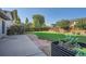 Backyard featuring a grassy lawn, fence, and a concrete patio at 4664 S Zang St, Morrison, CO 80465