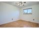 Bedroom featuring hardwood floors, a ceiling fan, and natural light from the window at 4664 S Zang St, Morrison, CO 80465