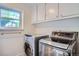 Laundry room featuring modern washer and dryer at 4664 S Zang St, Morrison, CO 80465